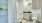 bathroom with a large mirror and walk-in shower