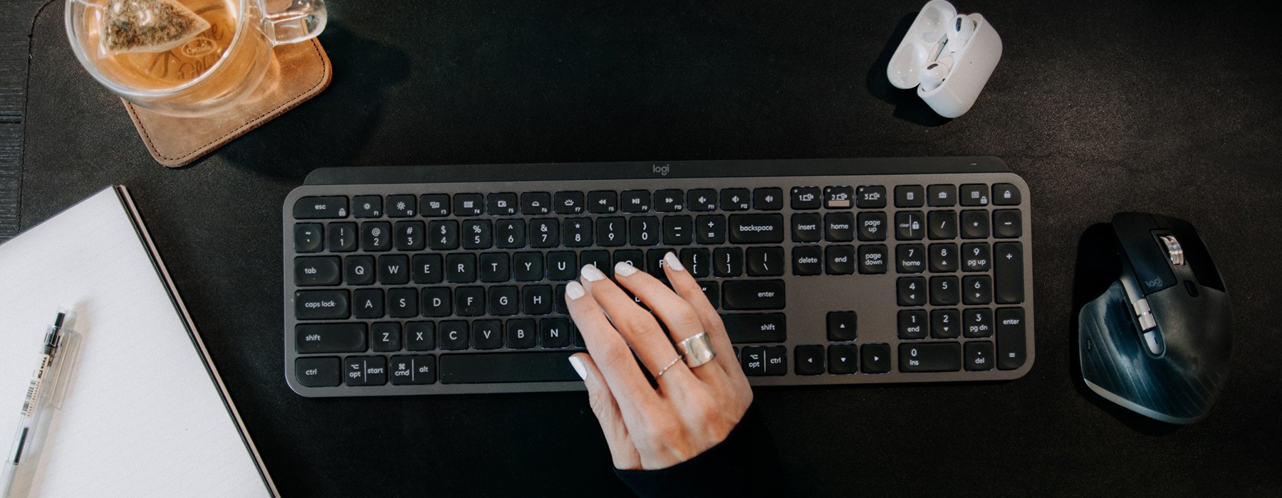 hands typing on a keyboard