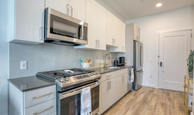 a kitchen with white cabinets